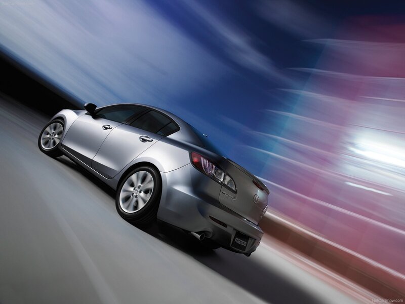 Silver Mazda3 in motion