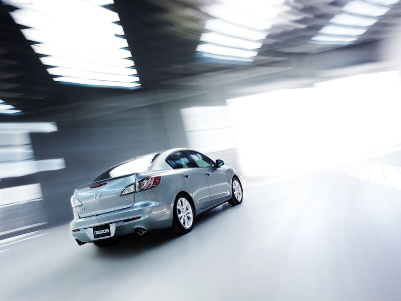 Silver Mazda3 in motion