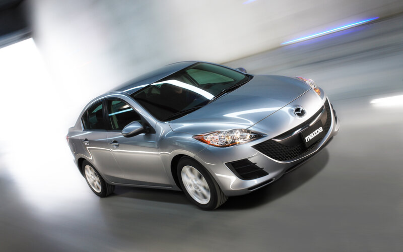 Silver Mazda3 sedan in motion