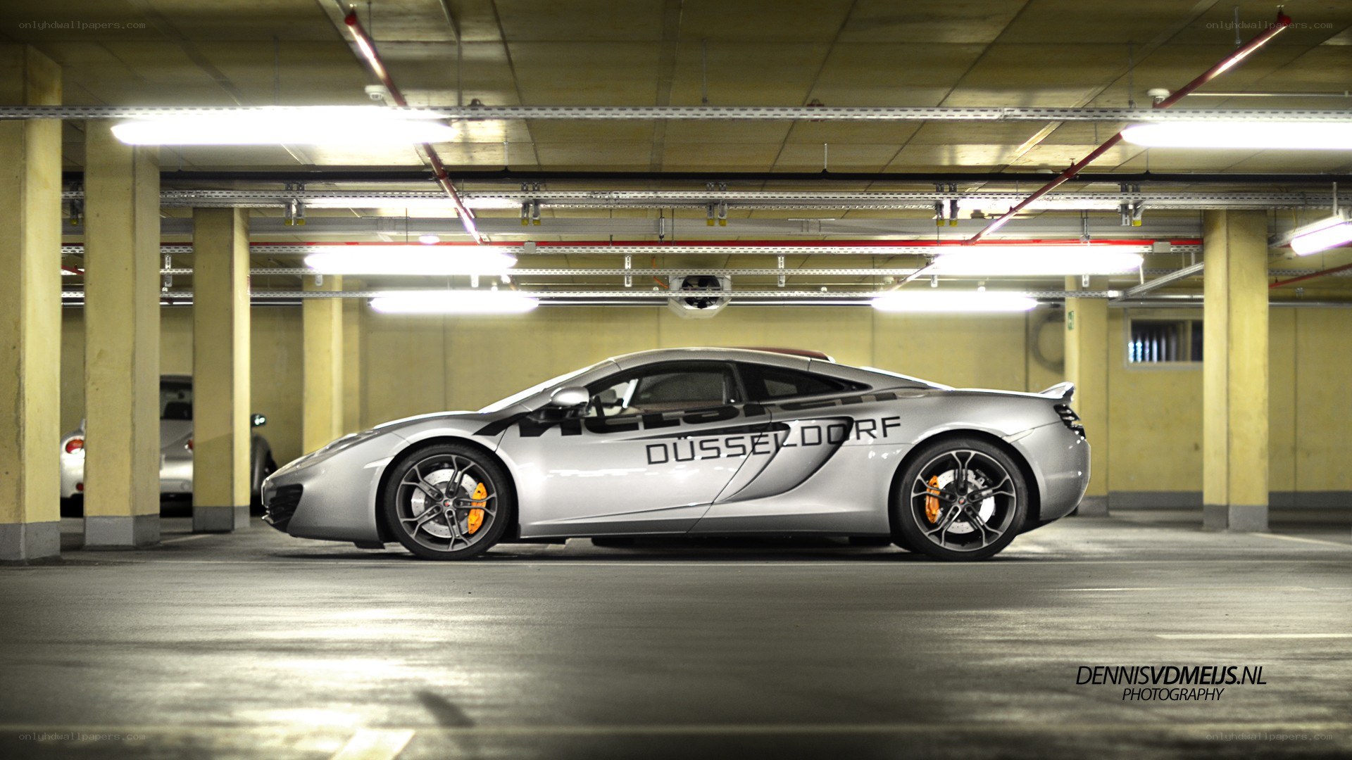 Silver McLaren in parking garage