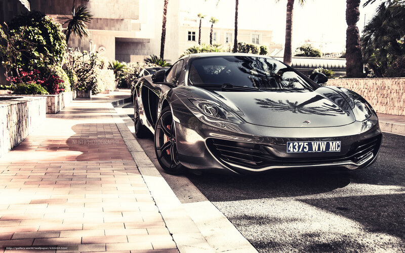 Silver McLaren on a sunny street