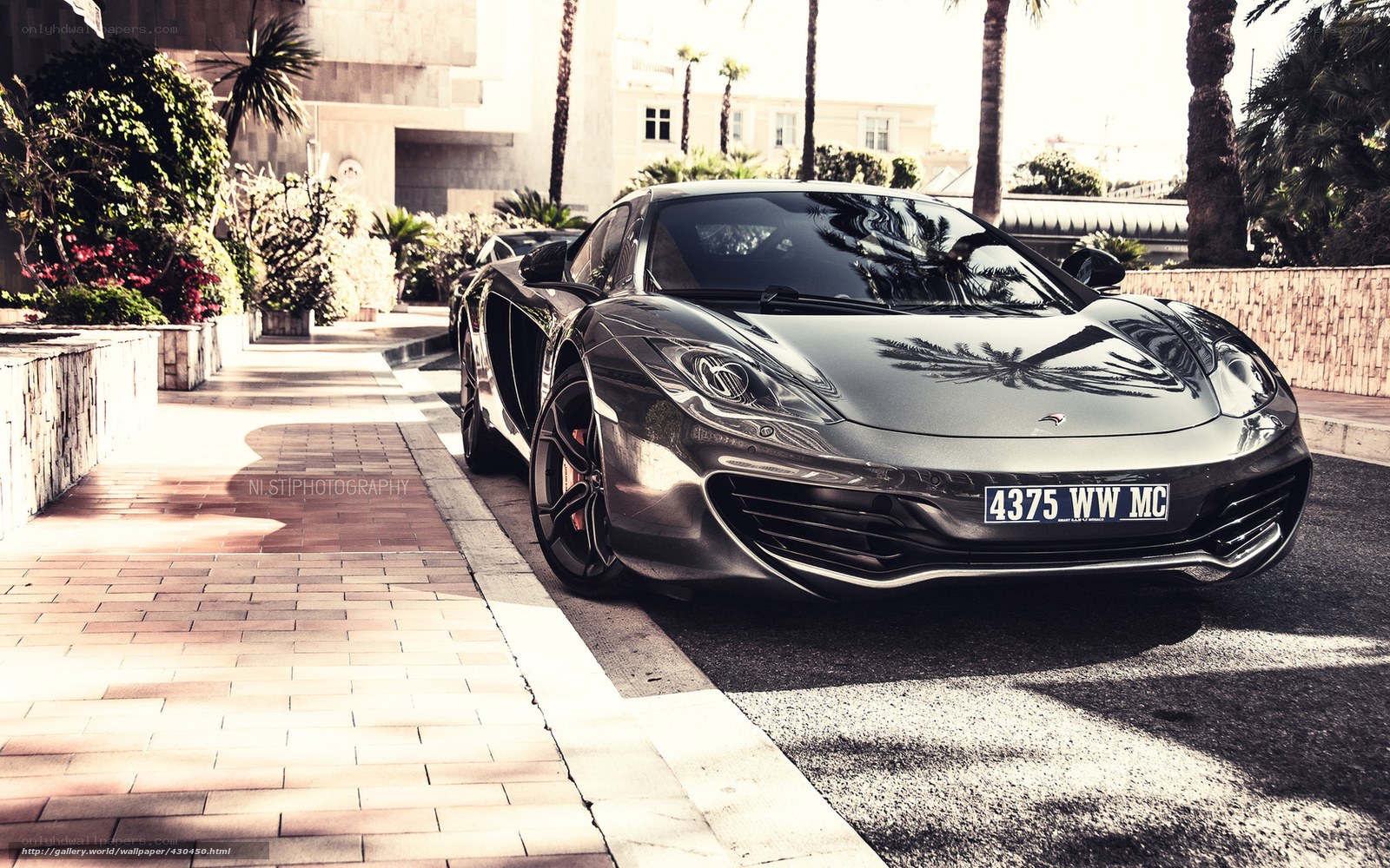 Silver McLaren on a sunny street