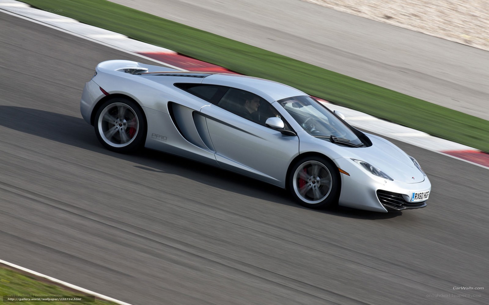 Silver McLaren on racetrack