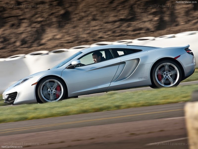 silver mclaren on track
