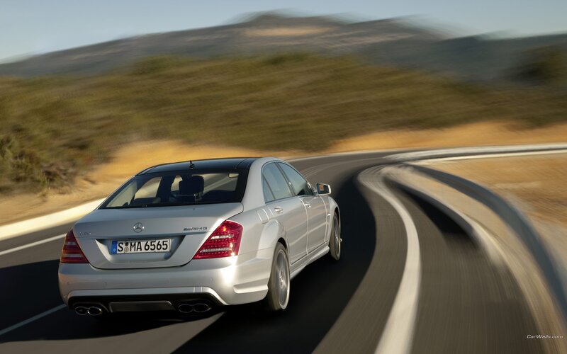 silver mercedes-amg on winding road