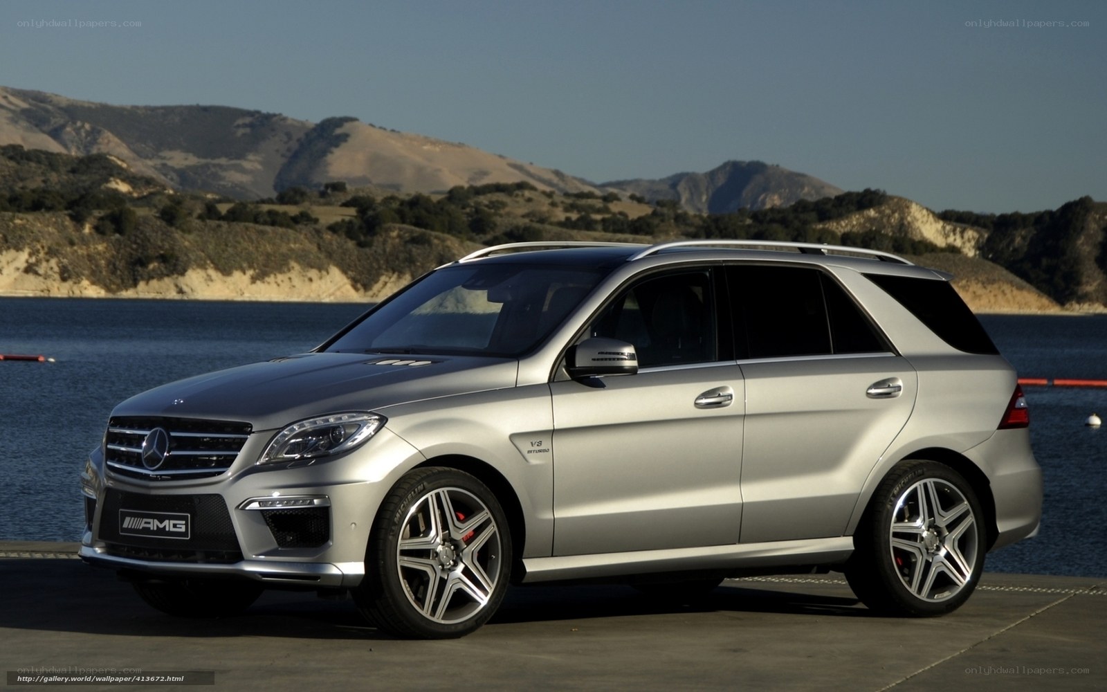 Silver Mercedes-AMG SUV by the lake