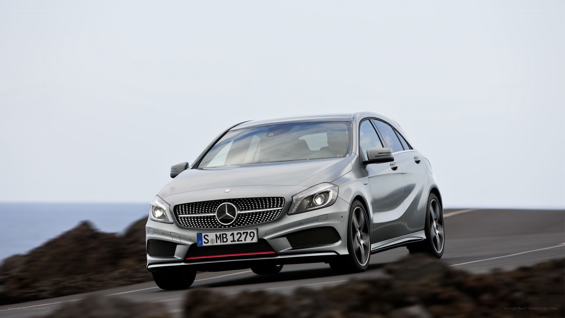 silver mercedes-benz a-class driving