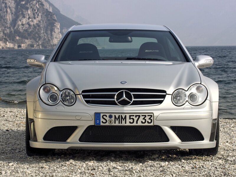 Silver Mercedes-Benz AMG on a pebble beach