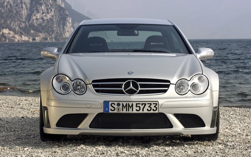 Silver Mercedes-Benz AMG on a pebble beach