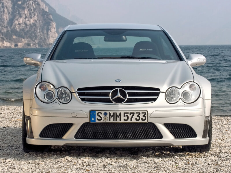 Silver Mercedes-Benz AMG on a pebble beach
