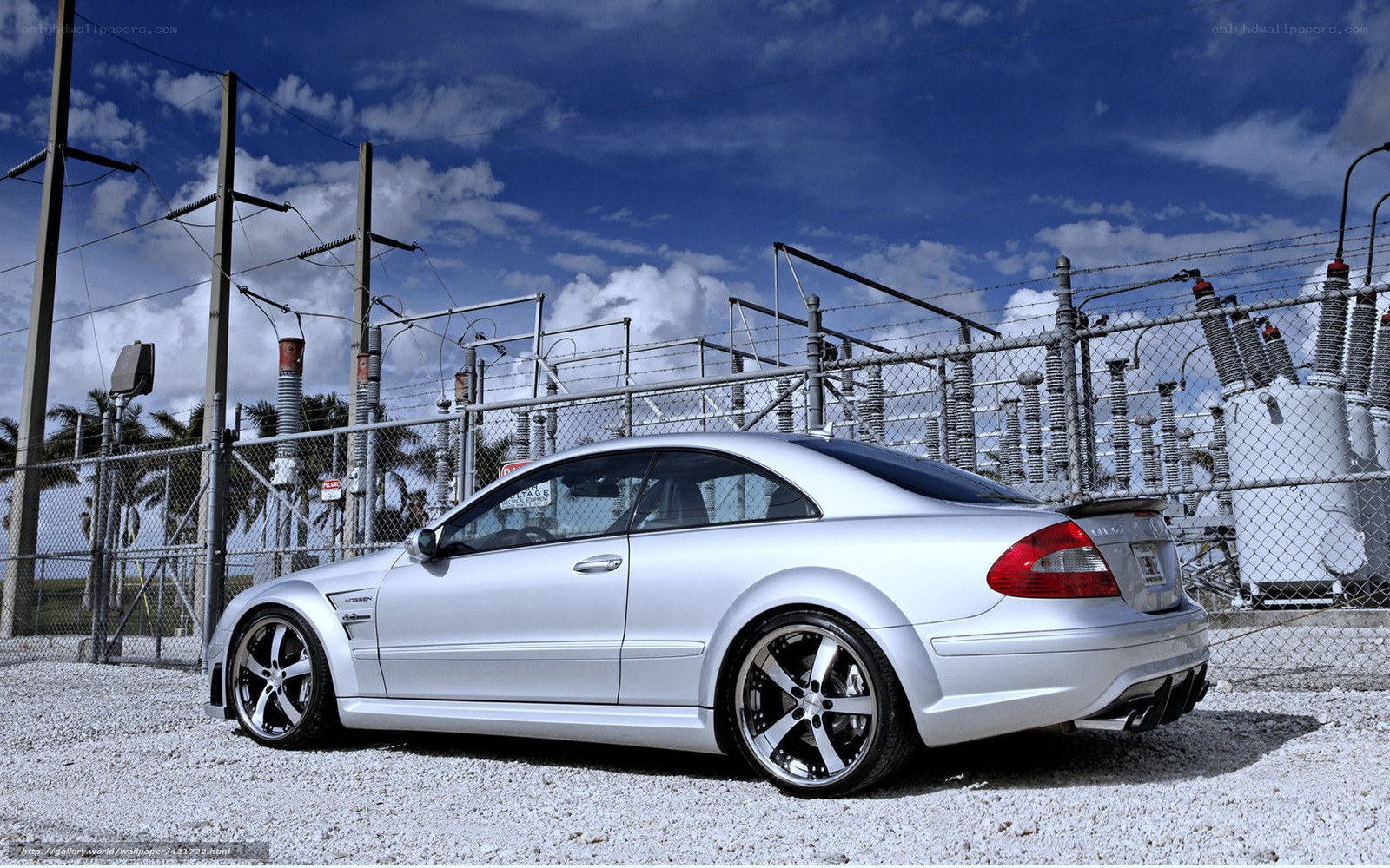 Silver Mercedes-Benz at power station