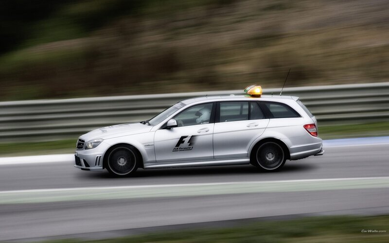 Silver Mercedes-Benz C63 AMG on a racetrack