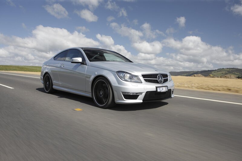 Silver Mercedes-Benz C63 AMG on road