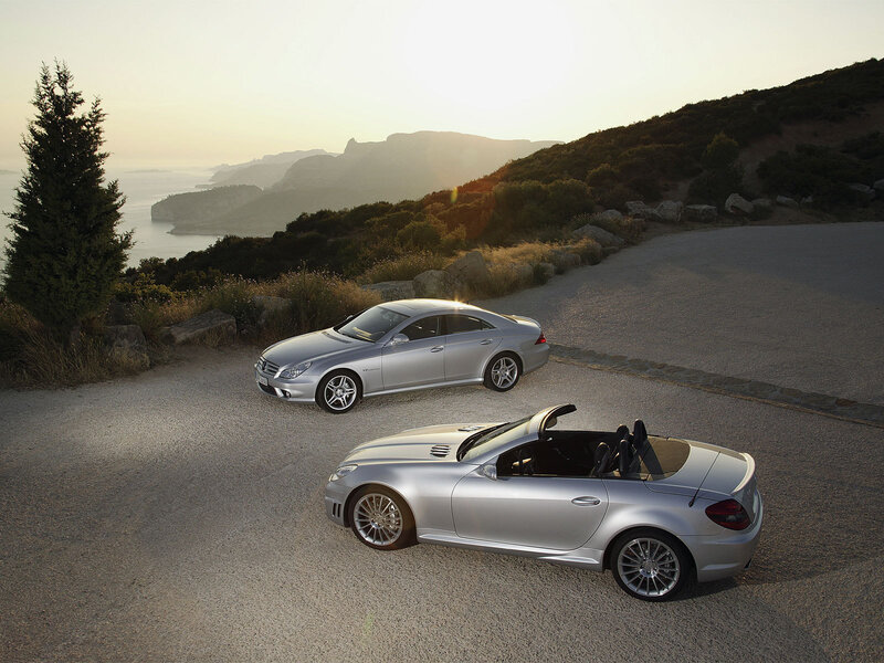 Silver Mercedes-Benz cars on a coastal road