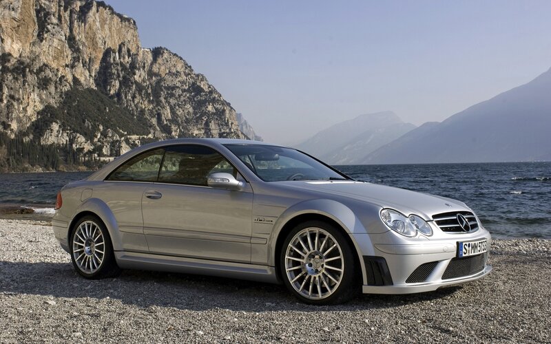 Silver Mercedes-Benz CL63 AMG by a lake