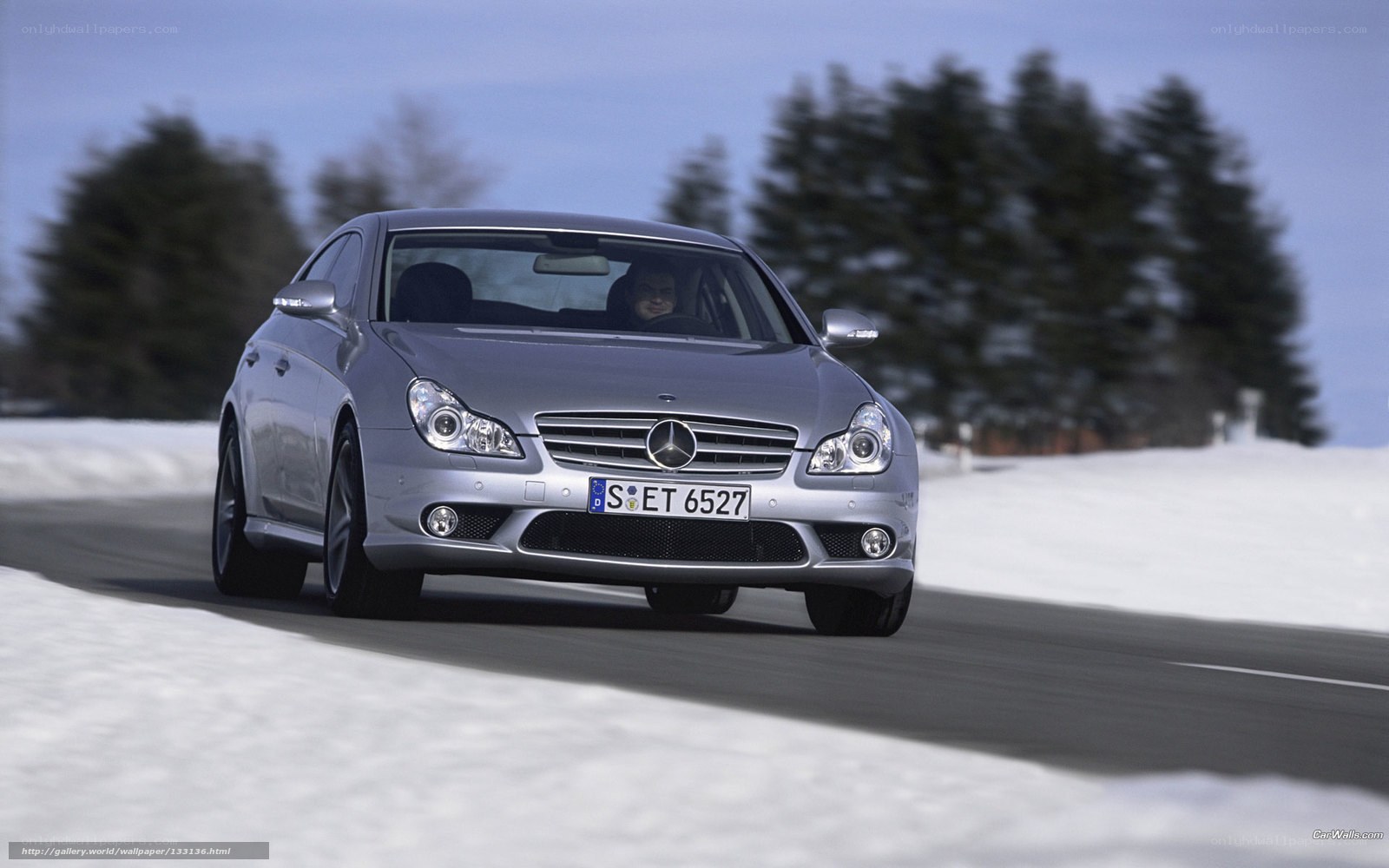 Silver Mercedes-Benz CLS driving in snow