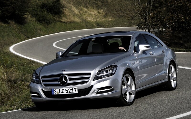 Silver Mercedes-Benz CLS driving on road