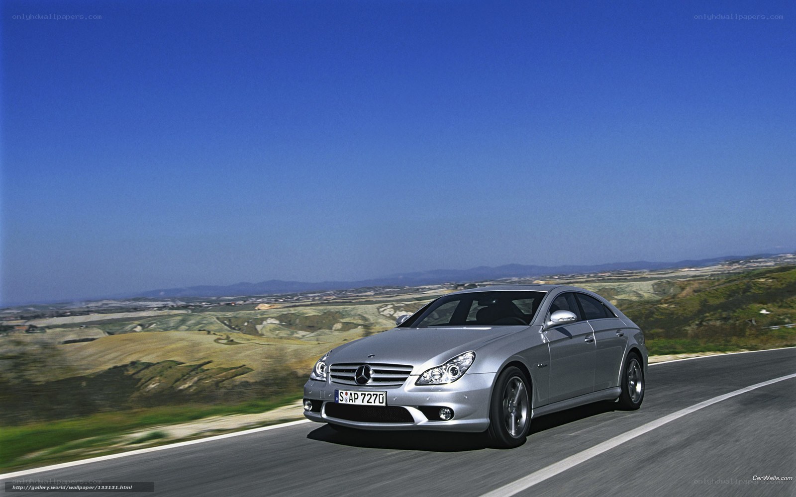 Silver Mercedes-Benz CLS driving on road