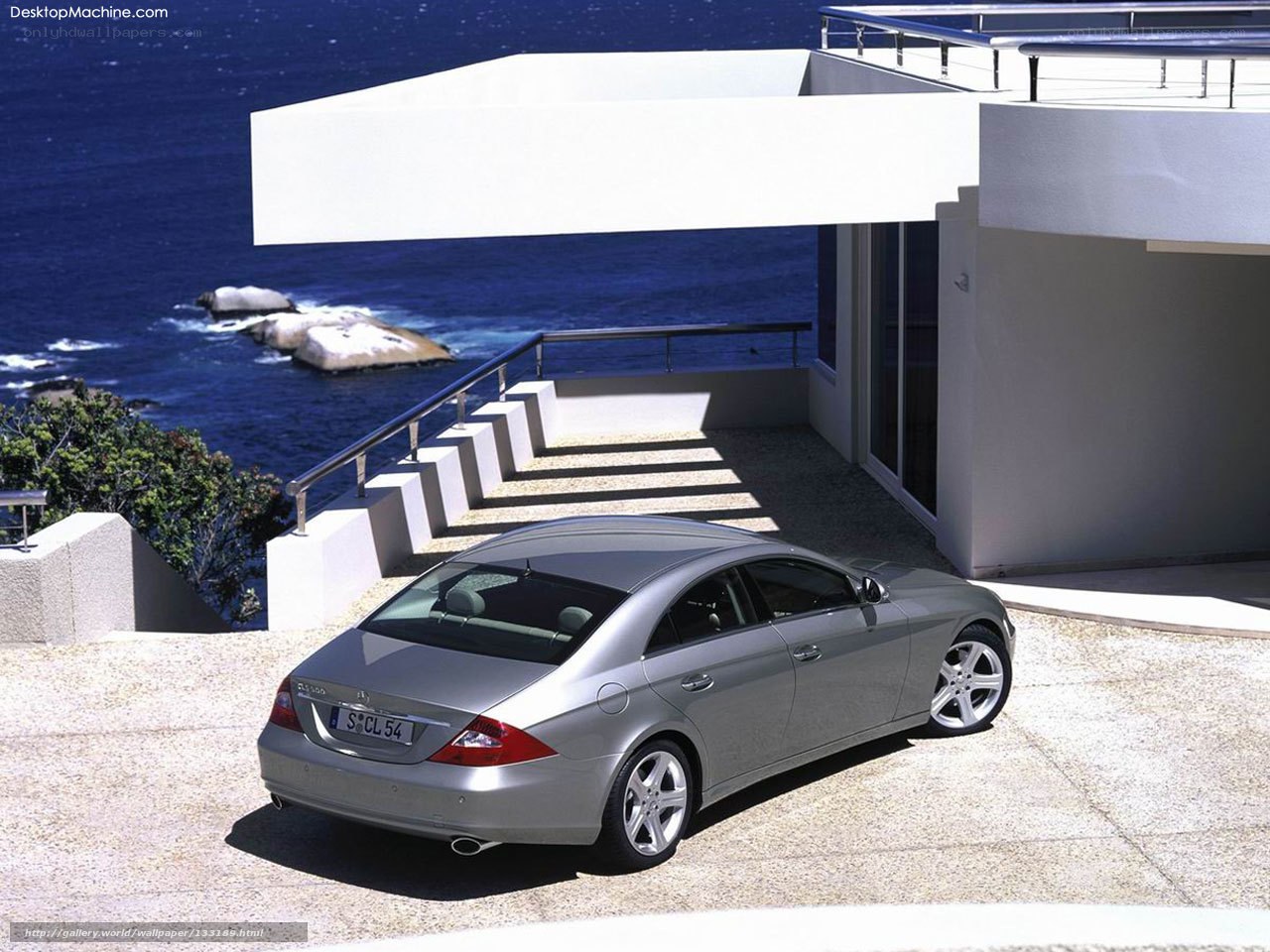 Silver Mercedes-Benz CLS parked by the sea