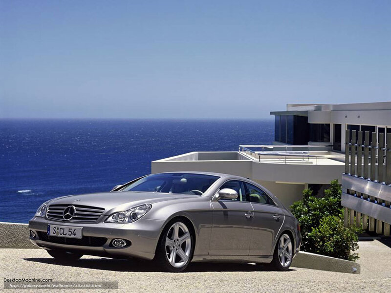 Silver Mercedes-Benz CLS parked by the sea