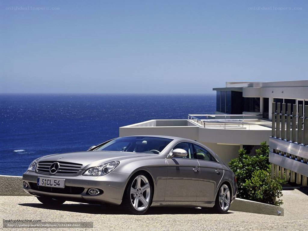 Silver Mercedes-Benz CLS parked by the sea