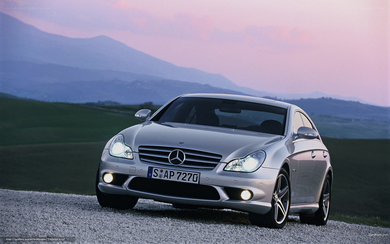 Silver Mercedes-Benz CLS parked on gravel