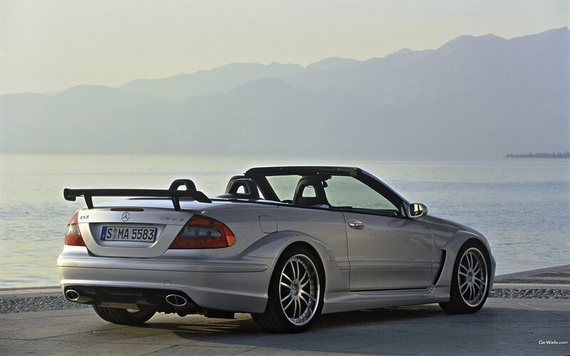 Silver Mercedes-Benz convertible by lake