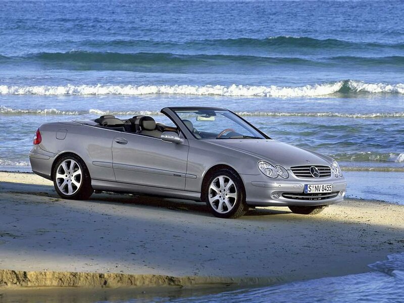 Silver Mercedes-Benz convertible on beach