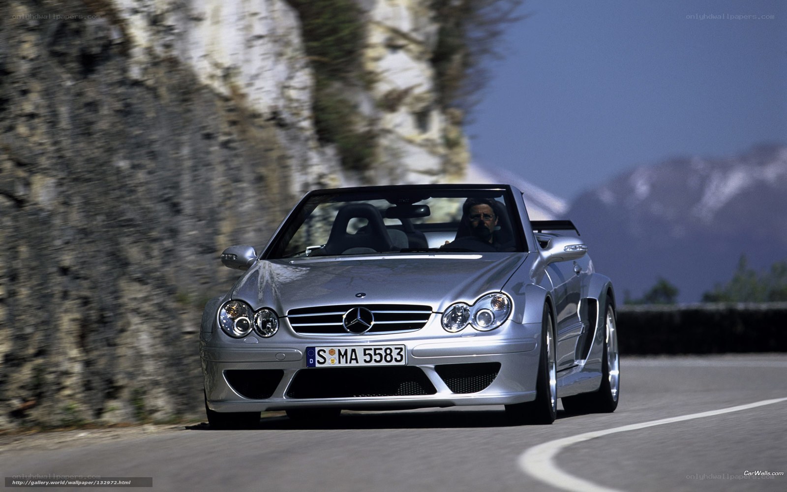 Silver Mercedes-Benz convertible on mountain road