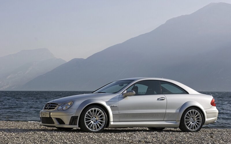silver mercedes-benz coupe by lake