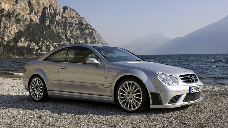 silver mercedes-benz coupe by lake
