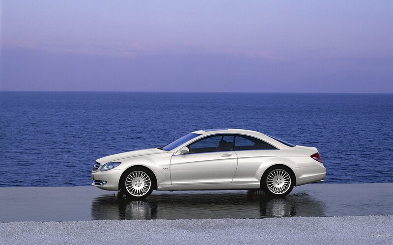 silver mercedes-benz coupe by the sea