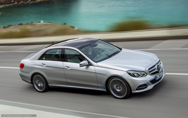 silver mercedes-benz driving on coastal road