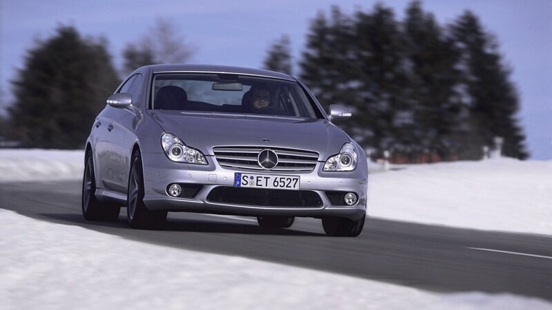 silver mercedes-benz driving on snowy road