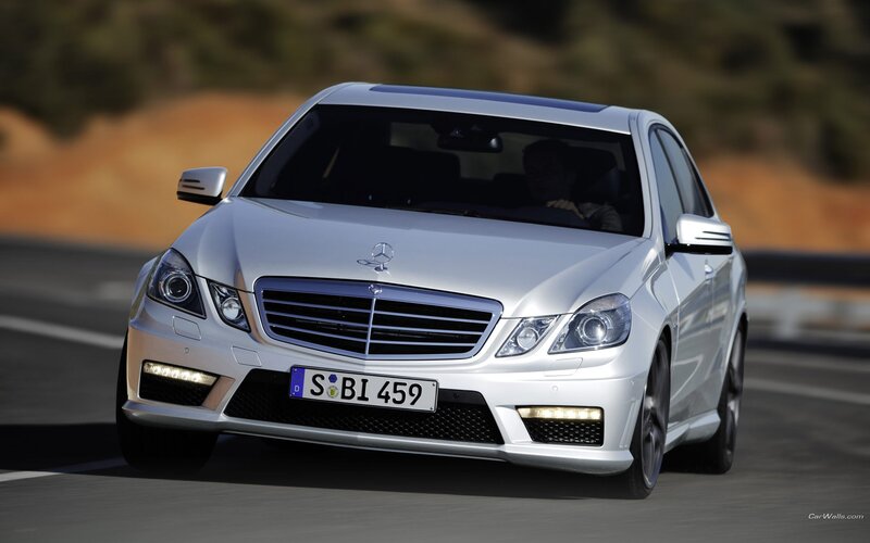 silver mercedes-benz e63 amg driving