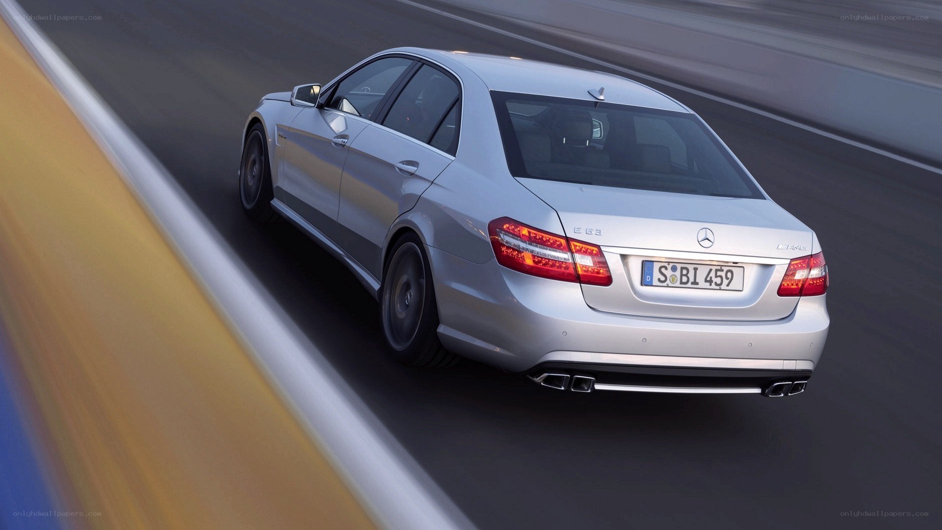 silver mercedes-benz e63 amg driving