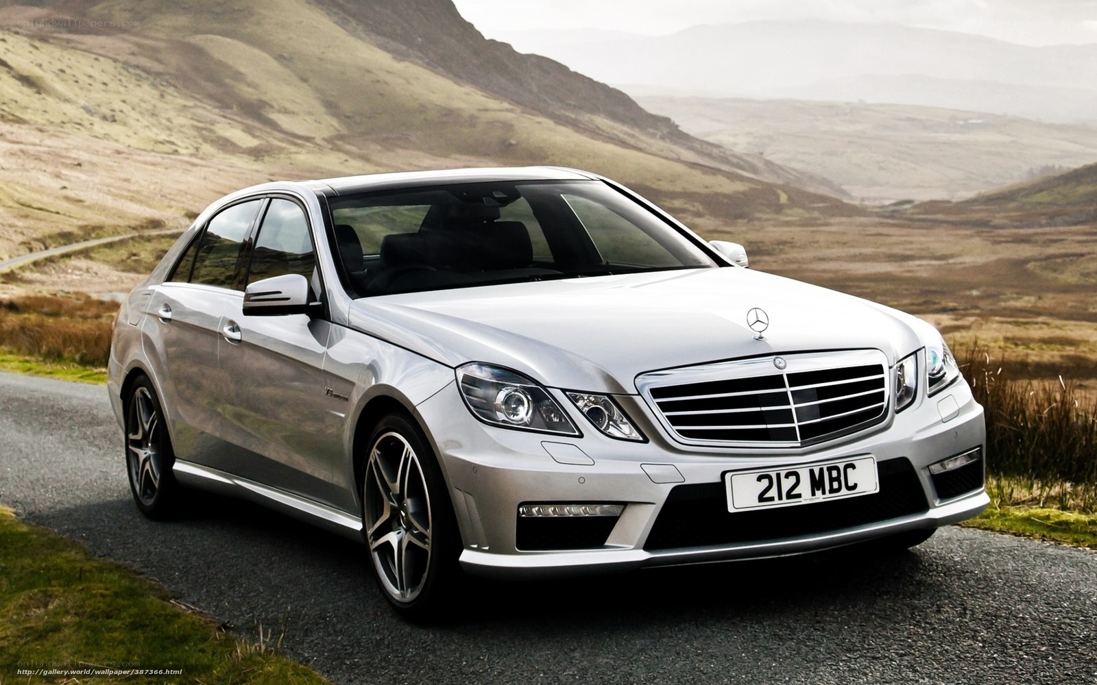 Silver Mercedes-Benz E63 AMG on a scenic road