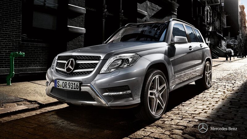 Silver Mercedes-Benz GLK parked on cobblestone