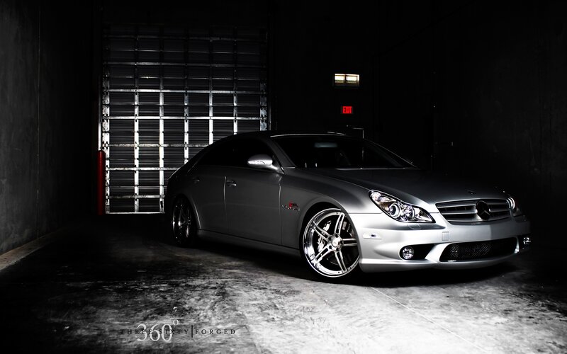 Silver Mercedes-Benz in a dark garage