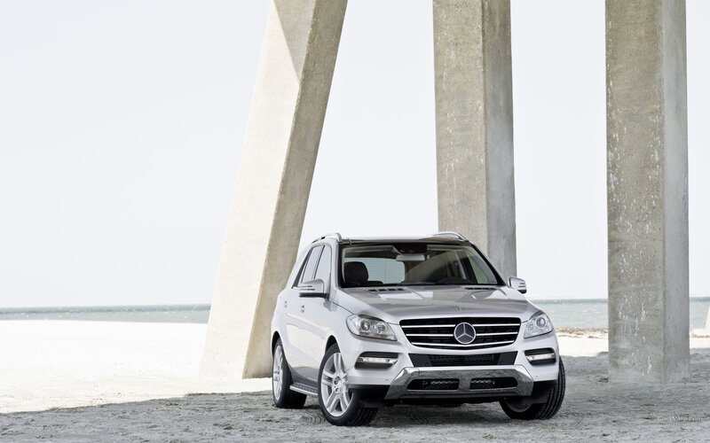Silver Mercedes-Benz ML parked on beach