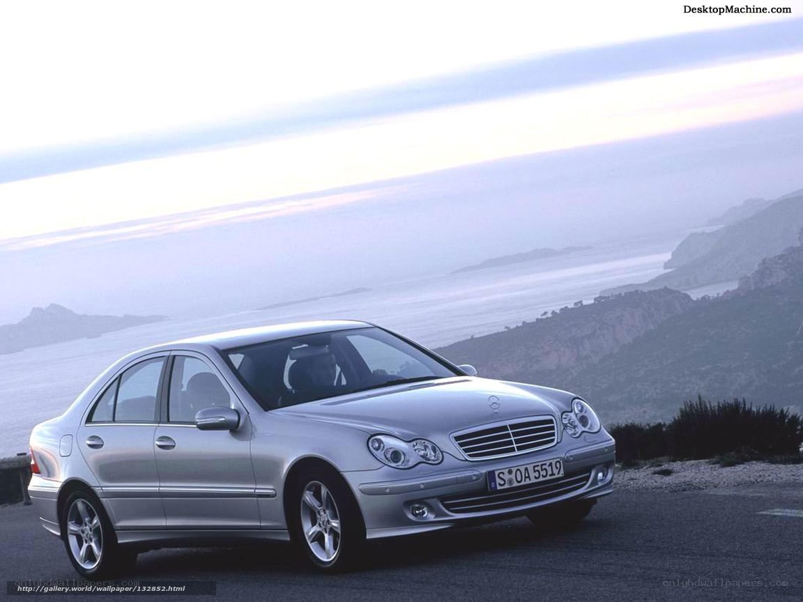 Silver Mercedes-Benz on a coastal road