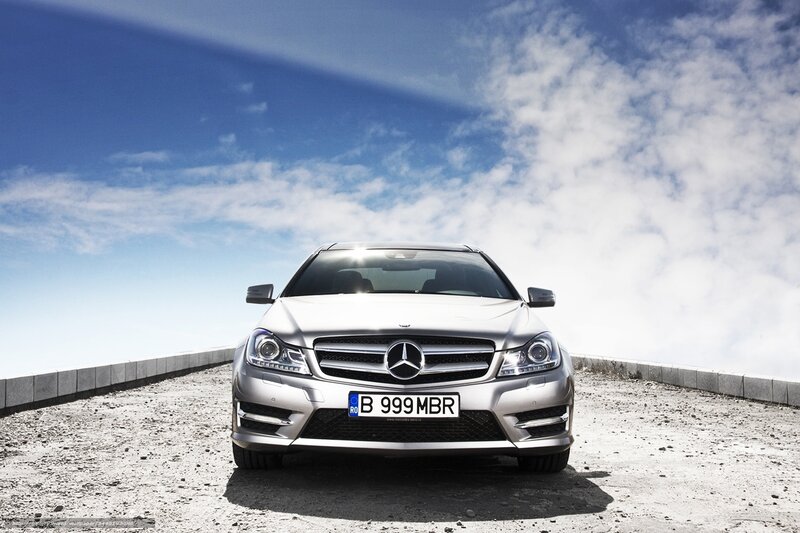 Silver Mercedes-Benz on a mountain road