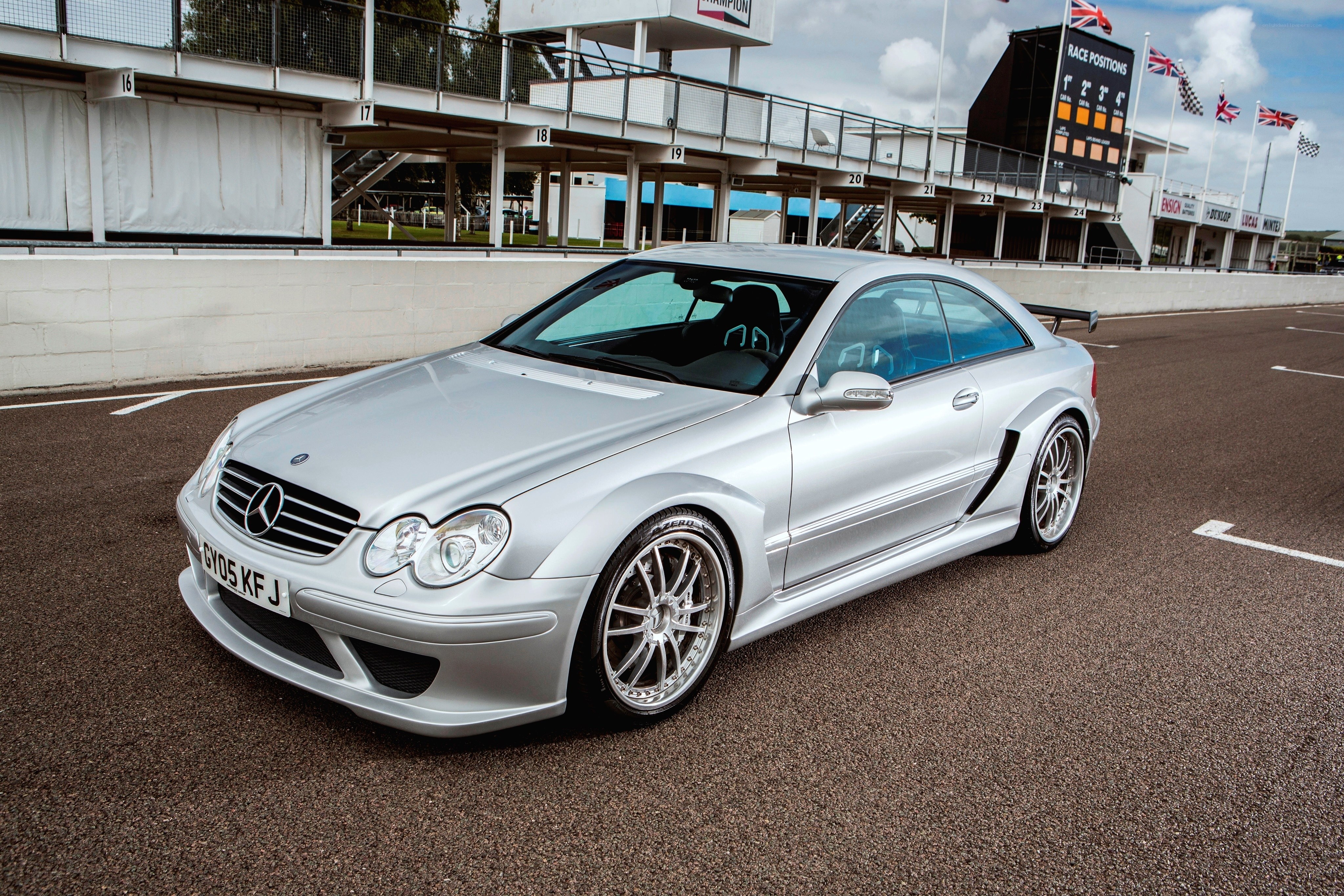 Silver Mercedes-Benz on a racetrack