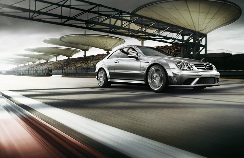 Silver Mercedes-Benz on a racetrack