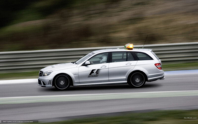 Silver Mercedes-Benz on a racetrack