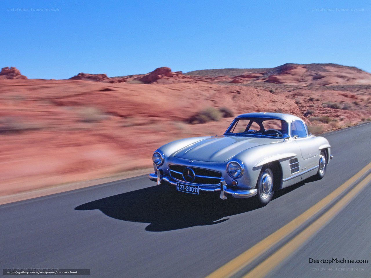 Silver Mercedes-Benz on desert road