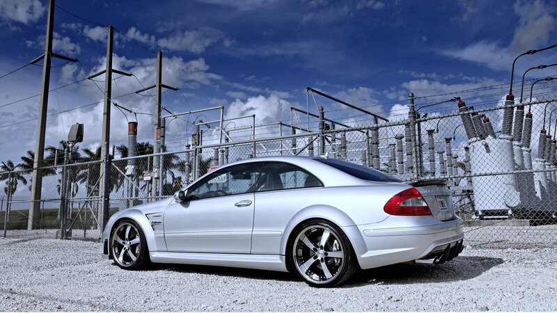 Silver Mercedes-Benz parked near power station