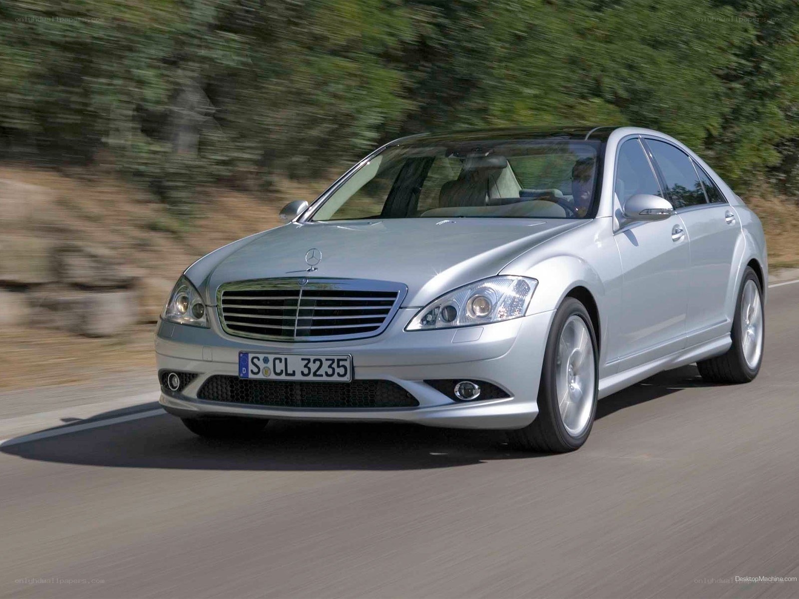 silver mercedes-benz s-class driving