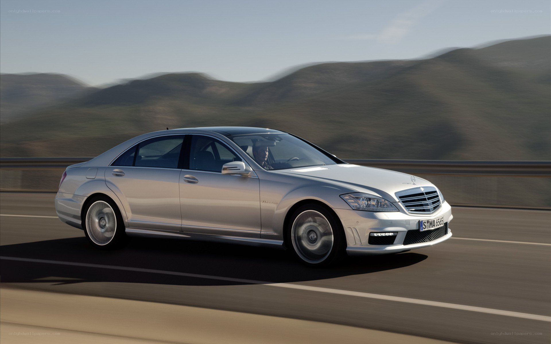 silver mercedes-benz s-class driving