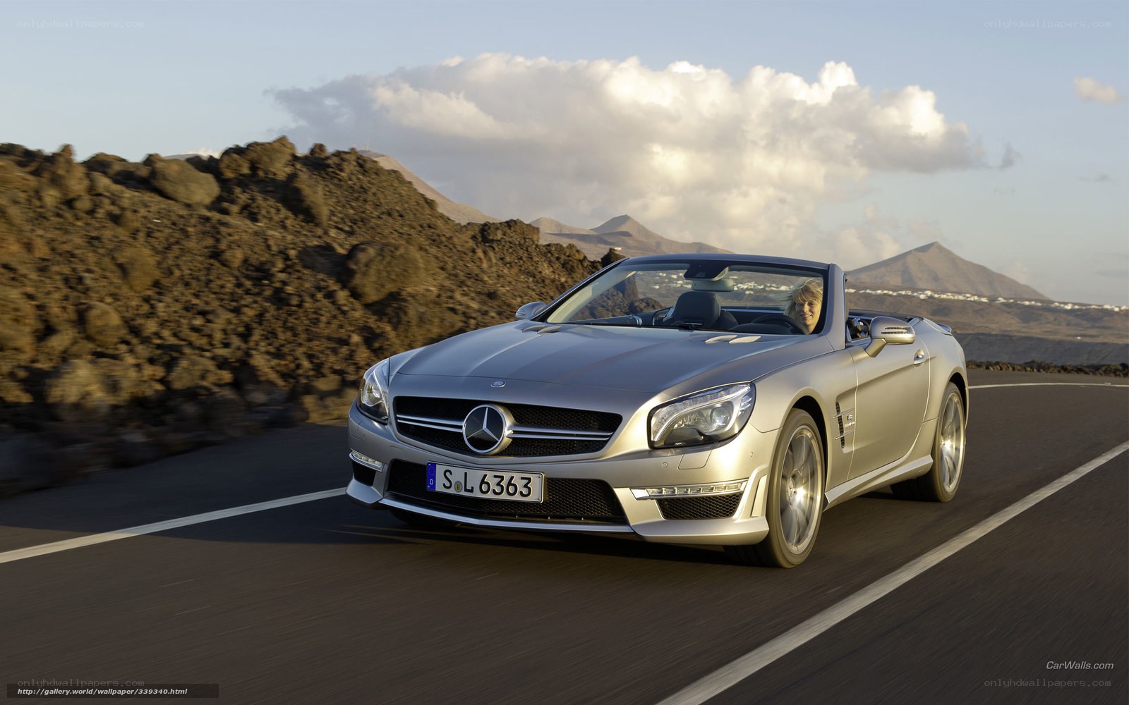 silver mercedes-benz sl500 driving
